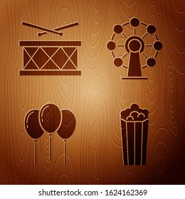 Set Popcorn in cardboard box, Drum with drum sticks, Balloons with ribbon and Ferris wheel on wooden background. Vector