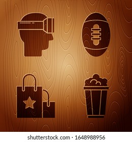 Set Popcorn in cardboard box, Virtual reality glasses, Paper shopping bag and American Football ball on wooden background. Vector
