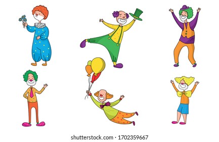 Set of positive clowns during show in colorful costumes