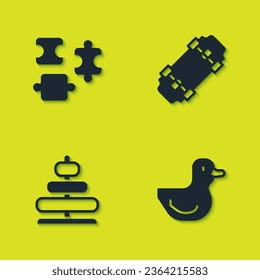 Set Puzzle pieces toy, Rubber duck, Pyramid and Skateboard icon. Vector