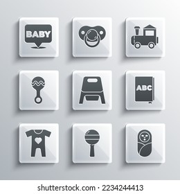 Set Rattle baby toy, Newborn infant swaddled, ABC book, Baby potty, clothes,  and Toy train icon. Vector