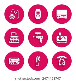 Set Ray gun, Ear with earring, Telephone handset, Joystick, Pager, Retro typewriter, Old video cassette player and Yoyo toy icon. Vector