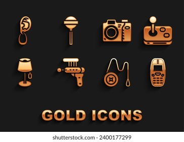 Set Ray gun, Joystick, Old mobile phone, Yoyo toy, Floor lamp, Photo camera, Ear with earring and Lollipop icon. Vector