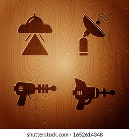 Set Ray gun, UFO flying spaceship, Ray gun and Radar on wooden background. Vector