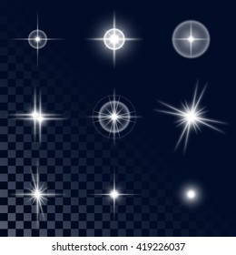 Set of the realistic beautiful white light star fires and flashes on a transparent background a vector illustration