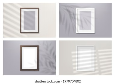 Set of realistic blank picture frames  hanging on a light wall from the Front. Design Template for Mock Up.