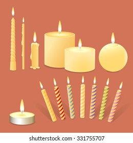 Set of realistic burning candles on a dark background.