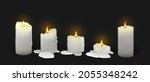 Set of realistic burning white candles on a black background. 3d candles with melting wax, flame and halo of light. Vector illustration with mesh gradients. EPS10.