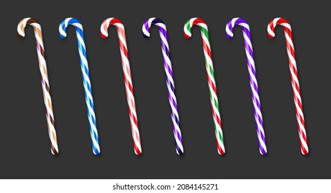 Set of realistic colorful candy canes. Black background. Vector holiday illustration.