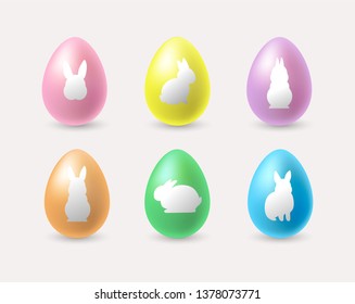 Set of realistic colorful Easter eggs with rabbit silhouettes. - Vector