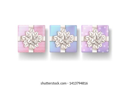Set of realistic gifts box with bow on white background. Vector illustration. Top view.