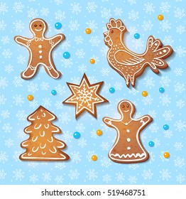 Set of realistic gingerbread cookies: rooster, star, christmas tree, man and woman on blue background with snowflakes