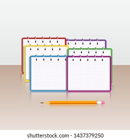 Set of realistic multi colored spiral notebook and pencil with eraser isolated on table. Design elements for education, stationery, back to school supplies, office supply