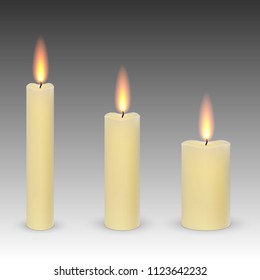 set of realistic paraffin burning candles isolated