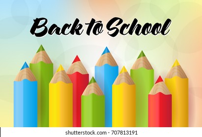 A set of realistic pencils or crayons on the colorful bokeh background. 
Back to School vector Illustration
