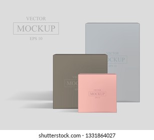 Set of realistic square cardboard packaging, paper boxes. High blue, brown and pink cardboard box mockup. Vector 3D illustration isolated collection 