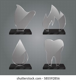 Set of realistic transparent glass trophy awards standing on black base and isolated on gradient background. Different shapes provided. Harp, tooth, flame, drop. Vector illustration.