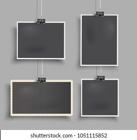 Set of realistic vector hanging photo frames  with paper clips on transparent background.