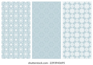 Set of rectangular Christmas seamless patterns. White snowflakes, stars on cold gray-blue winter background. Vector template for fabrics, textiles, wallpaper design, interiors, wrapping paper, pillows