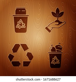 Set Recycle bin with recycle symbol and can, Recycle symbol and Plant in hand of environmental protection on wooden background. Vector