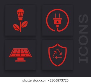 Set Recycle symbol inside shield, Light bulb with leaf, Electric plug and Solar energy panel icon. Vector