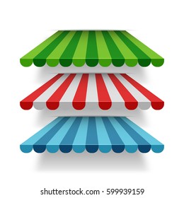 Set of red, blue, and green store roof awnings or tents