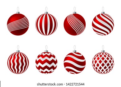 Set of red Christmas balls with gold ornament on a white background.