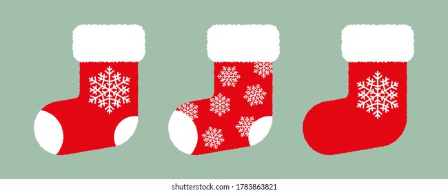 Set of red fluffy Christmas stockings with white snowflakes on green background. Vector Christmas gift socks. Flat vector Illustration. Simple design for web and print. Xmas icon