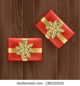 Set of red gift boxes with realistic golden ribbon on wooden background Top view. Birthday present, Holiday decoration element. Vector Eps 10 illustration.