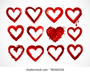 Set of red grunge hearts on white background.