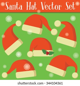 Set of red Santa Claus hats isolated on green background
