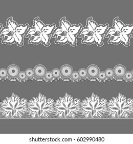 set of ribbons embroidered cutwork on a gray background