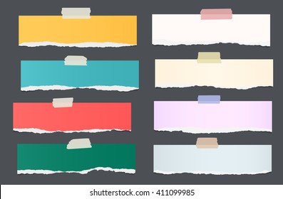 Set of ripped colorful note paper pieces are stuck on dark background