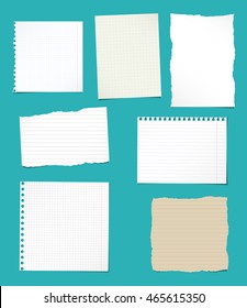 Set of ripped white and brown ruled, math notebook paper sheets.