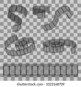 Set of rolled filmstrip rolls. Group of realistic movie and cinema elements or objects on the transparent effect background.