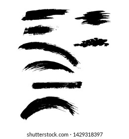 Set of rough inky brush strokes.