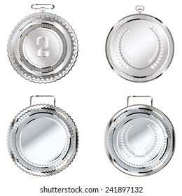 Set of round decorative silver medals on white background.