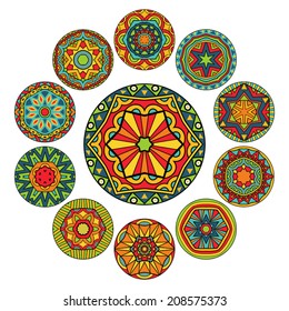 Set of round ethnic patterns. Eleven isolated design elements with abstract tribal ornaments. Decorative elements in bright colors. Vector file is EPS8, all elements are grouped apart and by colors.