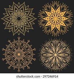 Set of round graphic design elements. Gold mandalas on black background. Vector template