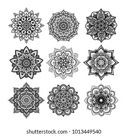 Set of round hand drawn mandala on white isolated background. Vector hipster mandala in monochrome. Mandala with floral patterns. Yoga template.