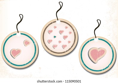 A set of round labels with hearts on an old paper. Vector illustration Eps10