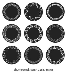 Set of round vector chalkboard labels or tags with white floral wreaths for craft projects and product design