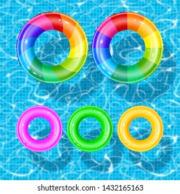 Set of rubber swim rings with different bright colors and designs. Rings are float in swimming pool water. Water wave, ripple and pool texture on background. Realistic vector illustration.