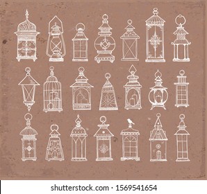 Set of rustic vintage lanterns on brown paper background. Big collection of old lamps