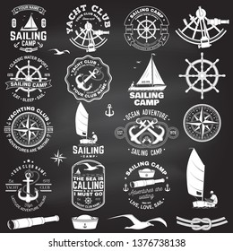 Set of sailing camp and yacht club badge. Vector on the chalkboard. Concept for shirt, print, stamp or tee. Vintage typography design with black sea anchors, hand wheel, compass and sextant silhouette