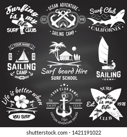 Set of sailing camp, yacht club and surf club badges. Vector on the chalkboard. Concept for shirt, print, stamp or tee. Vintage typography design with surfboard and sailing boat silhouette