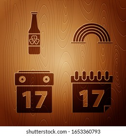 Set Saint Patrick's day with calendar, Beer bottle with four leaf clover, Saint Patrick's day with calendar and Rainbow on wooden background. Vector