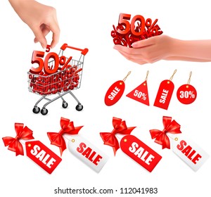 Set of sales tags with red gift bow and shopping carts with sale. Concept of discount. Vector illustration