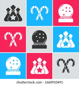Set Santa Claus bag gift, Christmas candy cane with stripes and Christmas snow globe with fallen snow icon. Vector