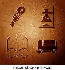 Set School Bus, Stationery knife, Glasses and Glass test tube flask on fire on wooden background. Vector